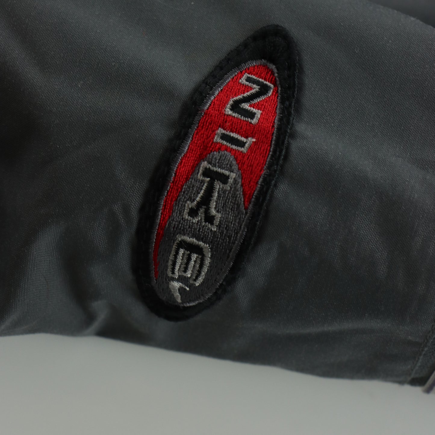 NIKE Embroidered Spell Out Logo Swoosh Parachute Grey Track Pants (L)