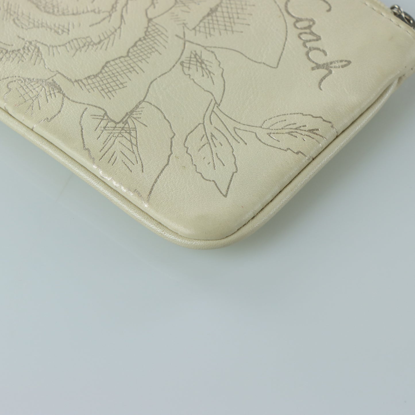 COACH Cream & Silver Rose Outline Wristlet