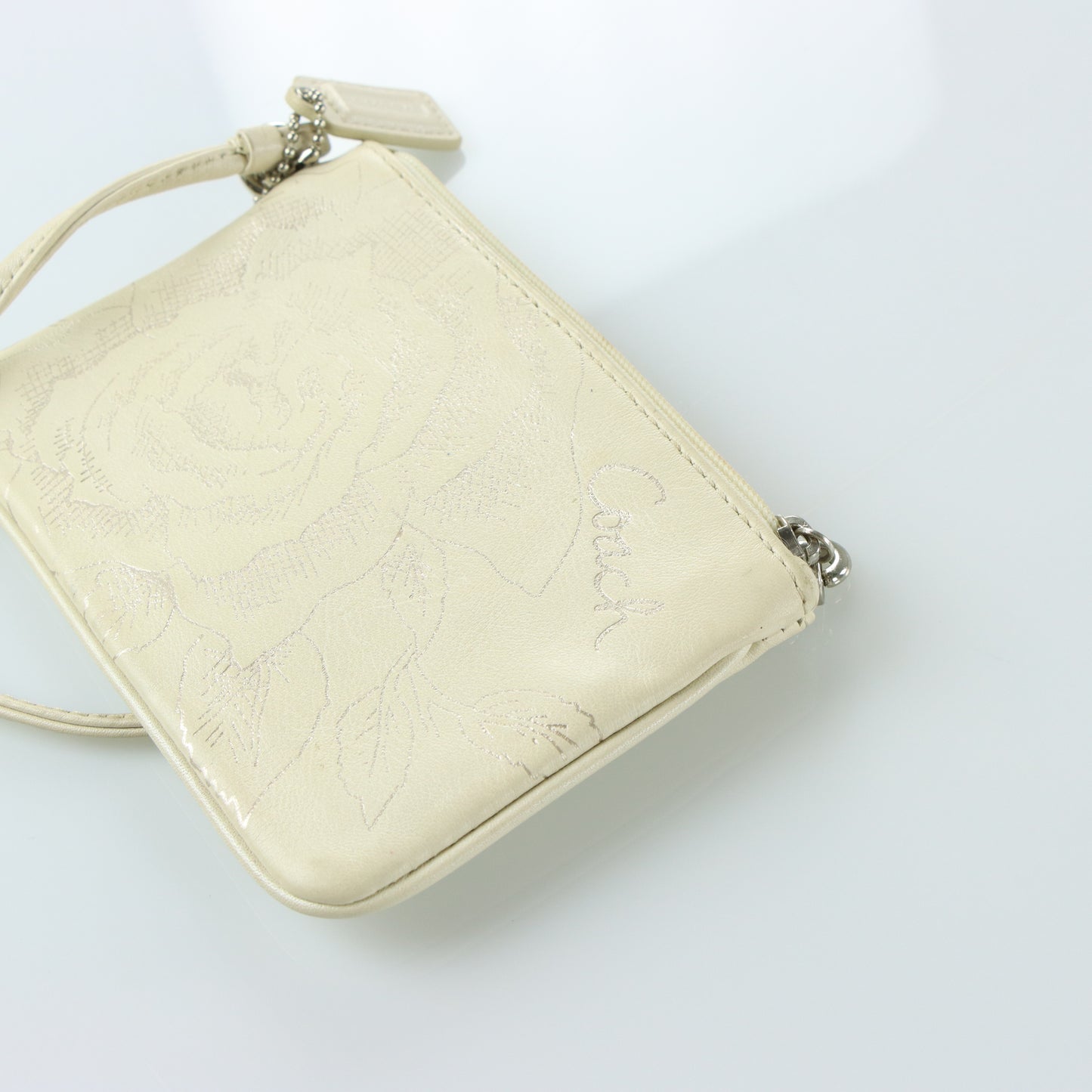COACH Cream & Silver Rose Outline Wristlet