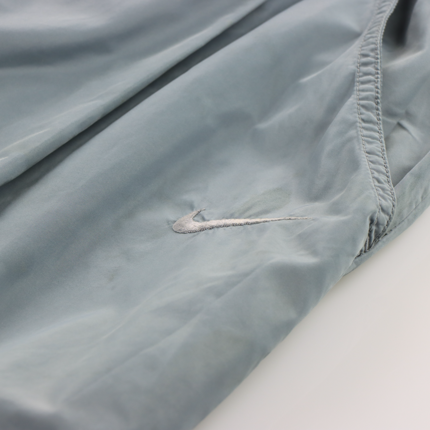 NIKE Embroidered Swoosh Logo Monochromatic Grey Track Pants (L)