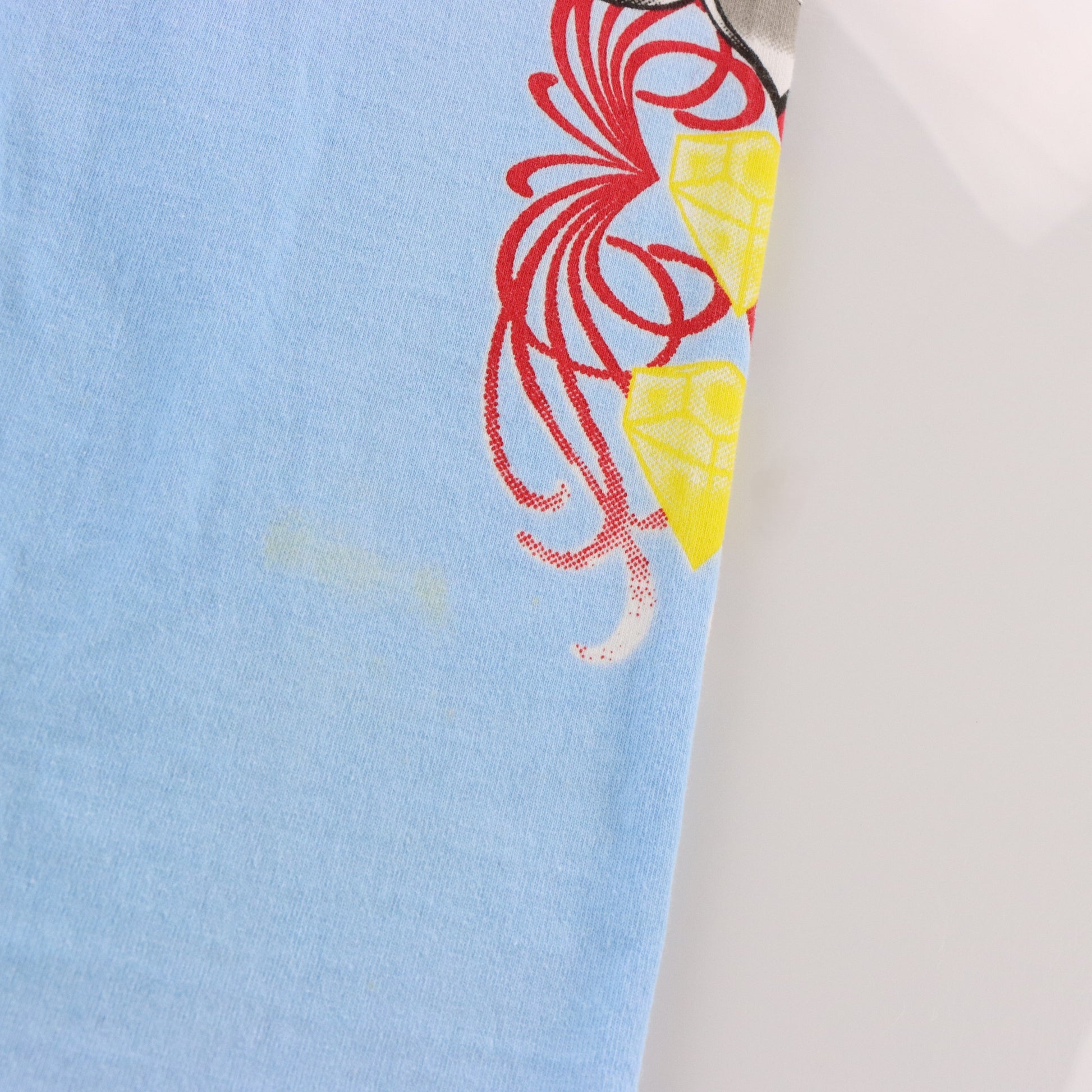 Vintage CHRISTIAN AUDIGIER "Trust" MCMVIII Light Blue & Gold Foil Paisley All Over Print Long Sleeve Tee (L-XL) Vintage Sole Melbourne
