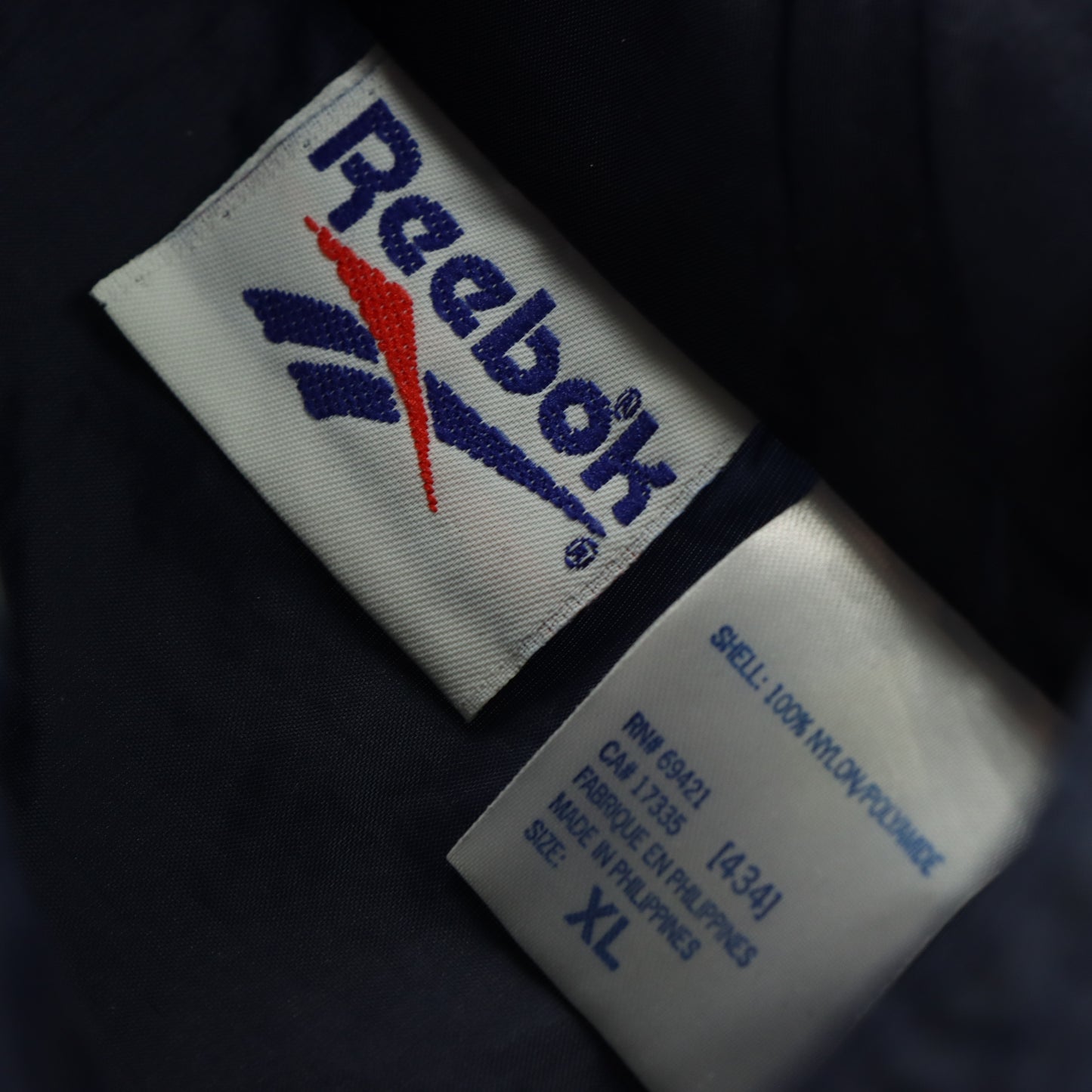 REEBOK Spell Out Embroidered Logo Navy Zip Up Windbreaker Jacket (XL)