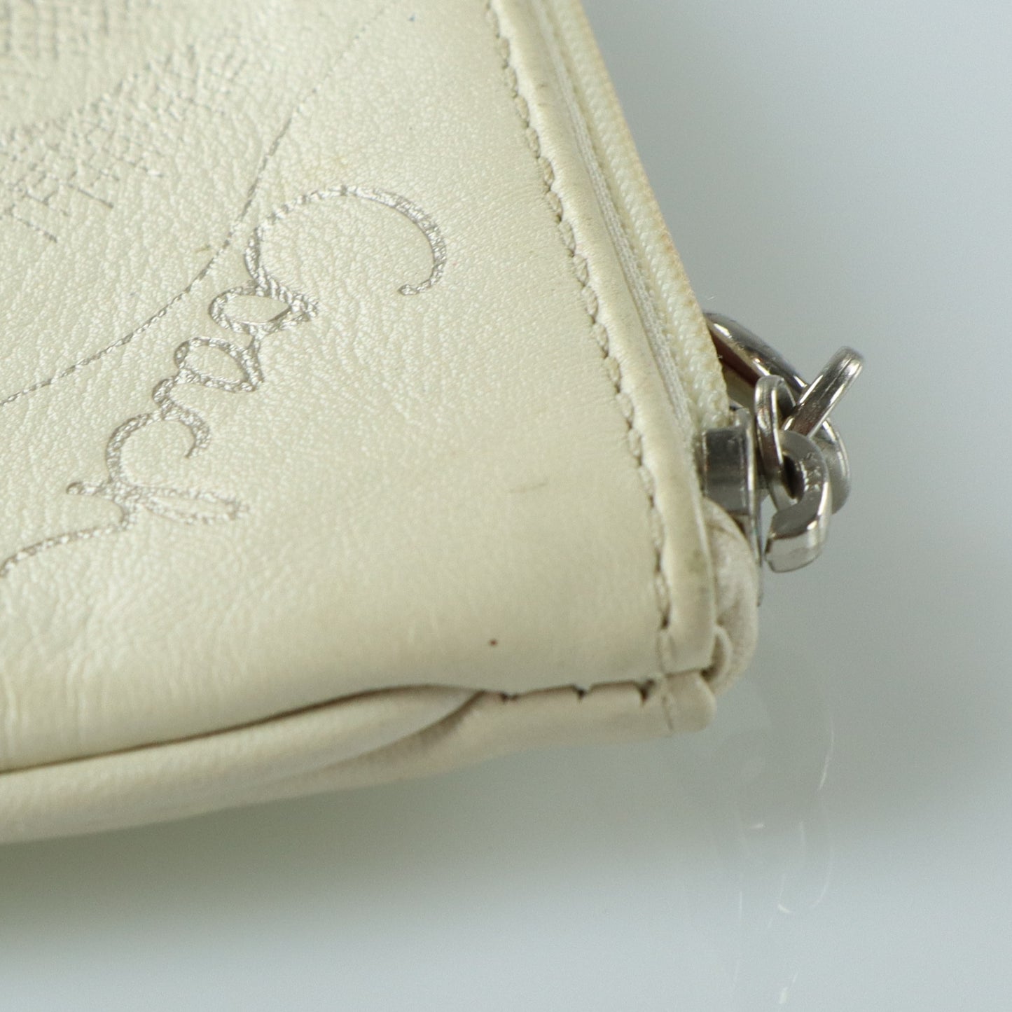 COACH Cream & Silver Rose Outline Wristlet