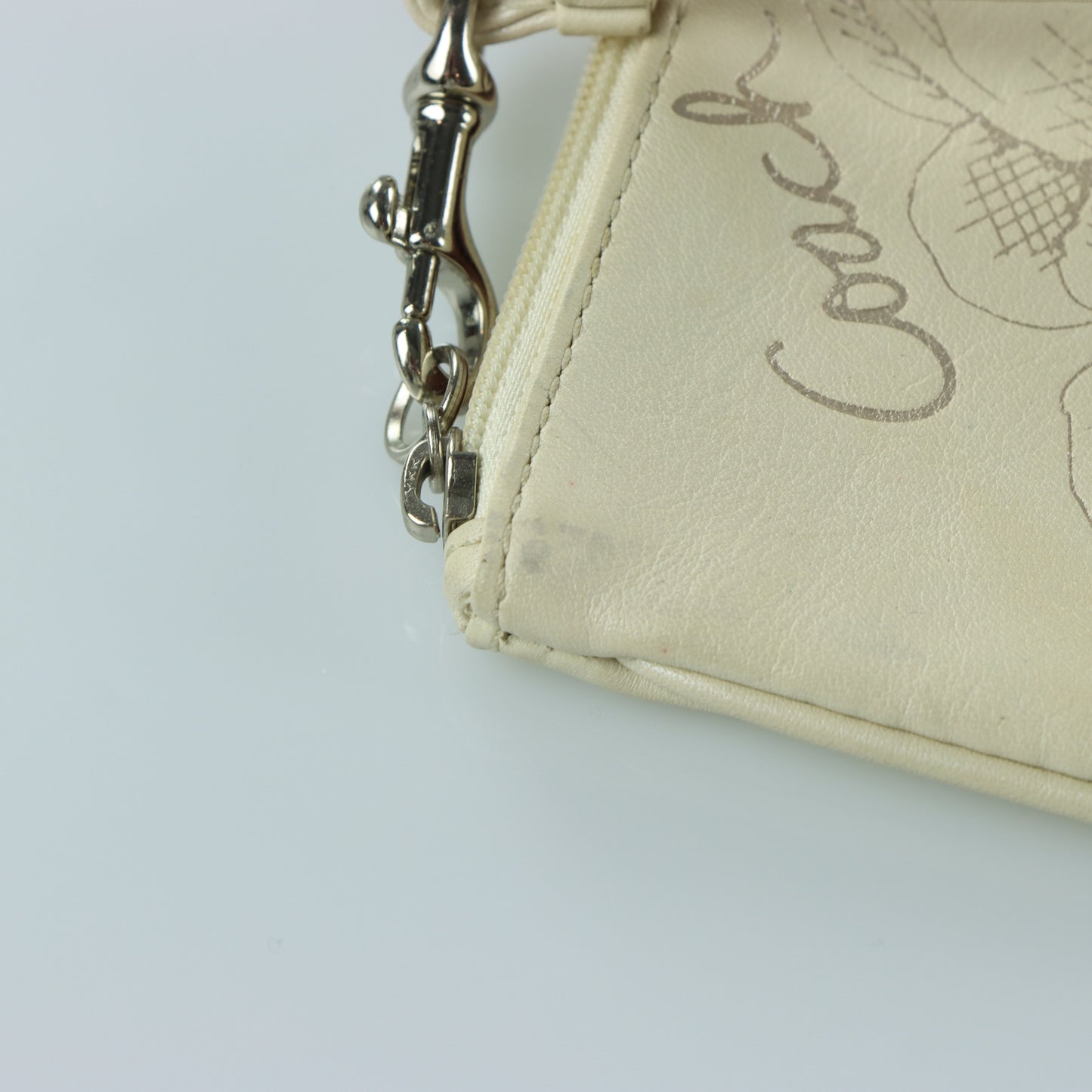 COACH Cream & Silver Rose Outline Wristlet
