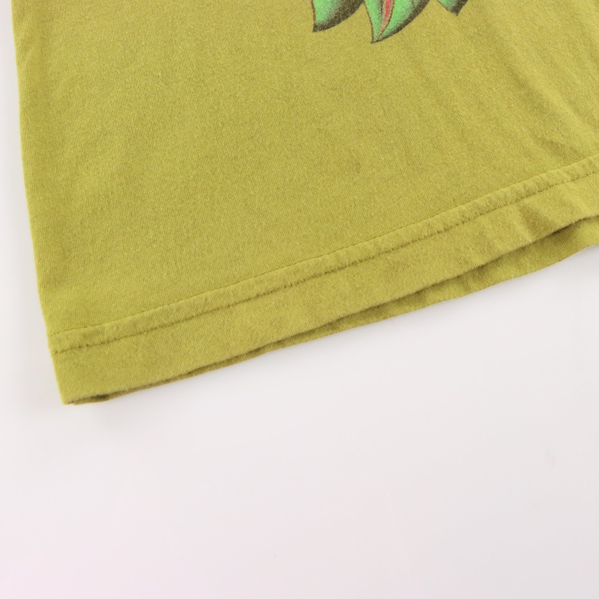 Vintage CHRISTIAN AUDIGIER "Heart Breaker" Gold Foil Logo Embellished Deity Pale Green Y2K Tee USA Made (XXL) ***COCO Vintage Sole Melbourne